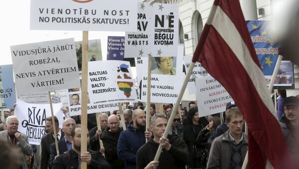 Акция протеста против приема беженцев в Латвии