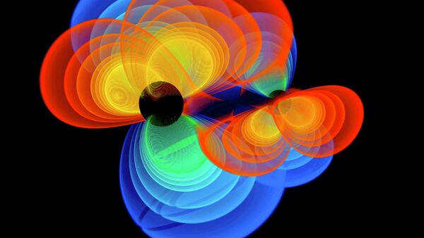 Так художник представил себе сливающиеся черные дыры и вырабатываемые ими гравитационные волны. Архив