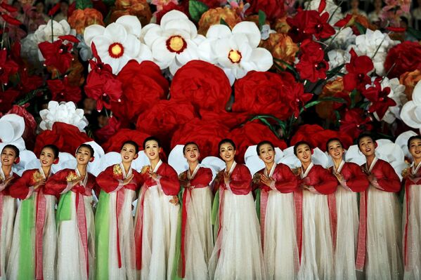 Участницы торжеств по случаю 70-летия Трудовой партии Кореи в Пхеньяне, КНДР