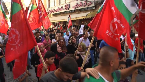 Палестинцы на марше в Джебалии требовали остановить насилие со стороны Израиля