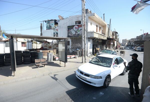 Контрольно-пропускной пункт на одной из улиц в Дамаске