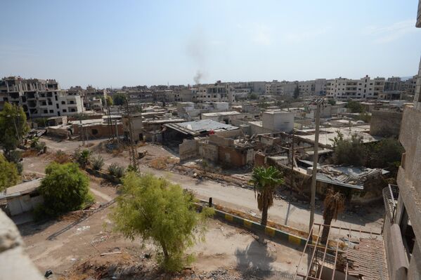 Разрушенные дома в пригороде Дамаска Дарайе