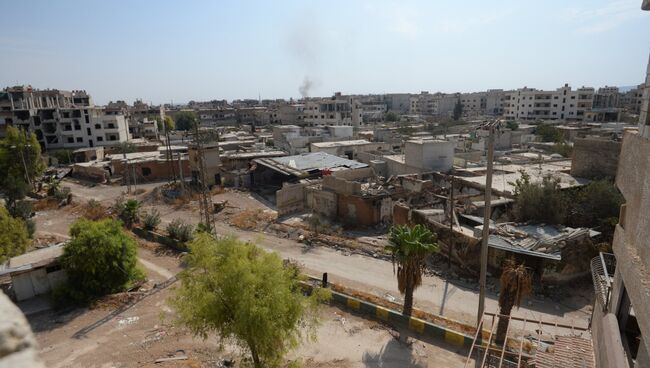 Разрушенные дома в пригороде Дамаска Дарайе