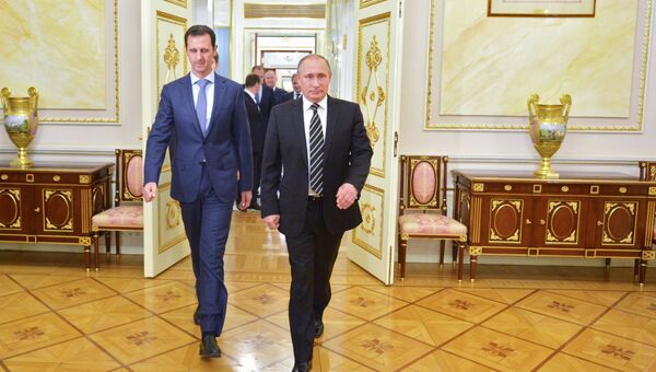 Президент России Владимир Путин (справа) и президент Сирии Башар Асад во время встречи в Кремле. Архивное фото