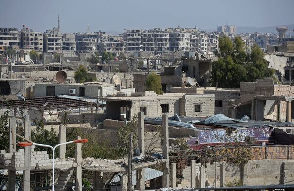 Разрушенные здания в городе Маадания в пригороде Дамаска