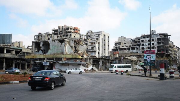 Разрушенные дома в сирийском городе Хомс