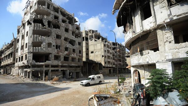 Разрушенные жилые дома в сирийском городе Хомс