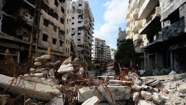 Разрушенные жилые дома в сирийском городе Хомс. Архивное фото