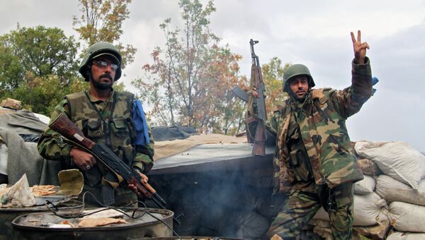 Отряд бойцов сирийского ополчения после боевого задания на севере Латакии. Архивное фото