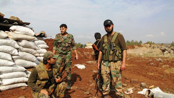 Солдаты сирийской армии на первой линии обороны в районе Шейх-Мискин, провинции Дераа, архивное фото