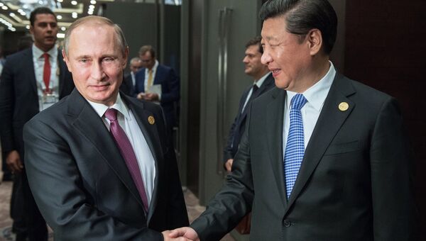 Президент России Владимир Путин и председатель Китайской Народной Республики (КНР) Си Цзиньпин во время встречи на полях саммита Группы двадцати (G20)