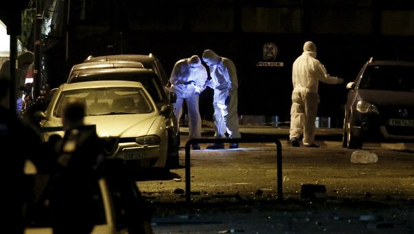Полиция на месте взрыва бомбы у здания федерации в центре Афин