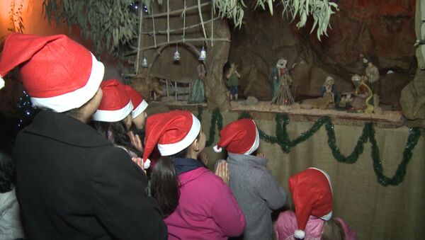 Молитва у вертепа и фото с Сантой – сирийские христиане отметили Рождество