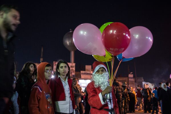 На улицах Дамаска во время празднования Рождества по Григорианскому календарю