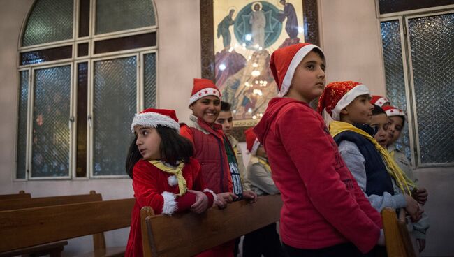 Жители Дамаска в церкви во время празднования Рождества по Григорианскому календарю. Архивное фото
