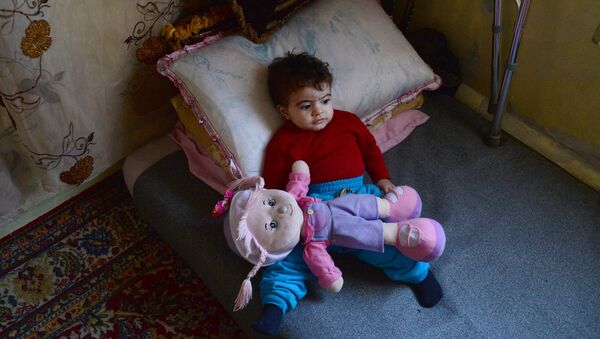 Сирийский ребенок-беженец, архивное фото