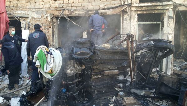 На месте взрывов в районе Аз-Захра города Хомс, Сирия