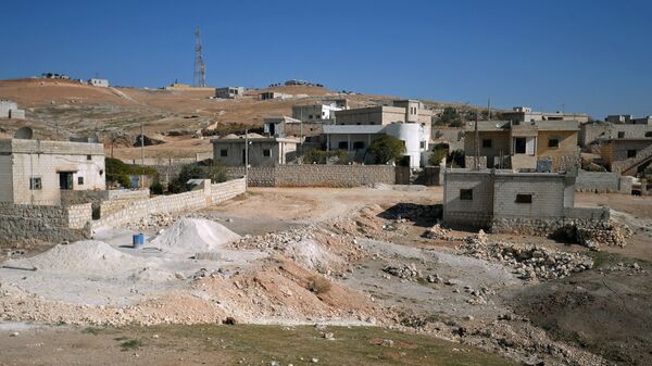 Здания в селе в южном пригороде сирийского города Алеппо
