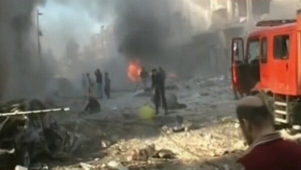 Взрыв и пожар на улицах Хомса – последствия тройного теракта в Сирии