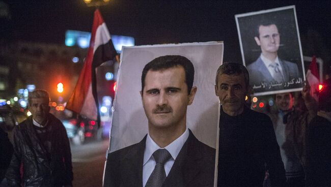 Плакат с изображением президента Сирии Башара Асада на одной из улиц Дамаска. Архивное фото