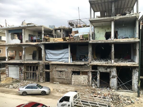 Разрушенное здание в Хомсе в Сирии