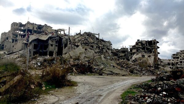Разрушенные здания в Хомсе в Сирии. Архивное фото