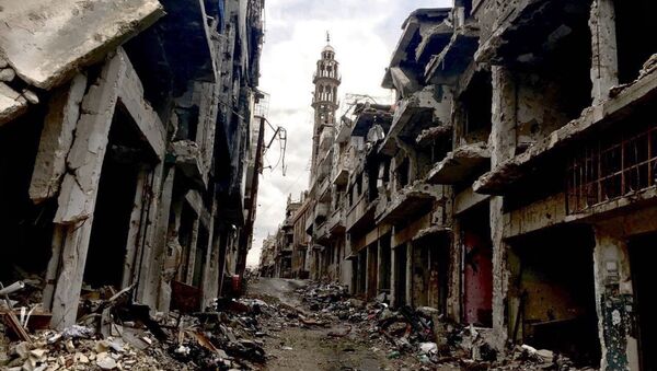 Разрушенные здания в сирийском городе Хомсе