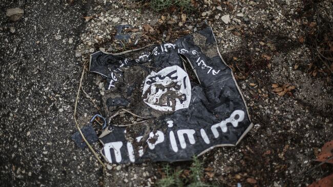 Флаг радикальной исламистской организации Исламское государство Ирака и Леванта