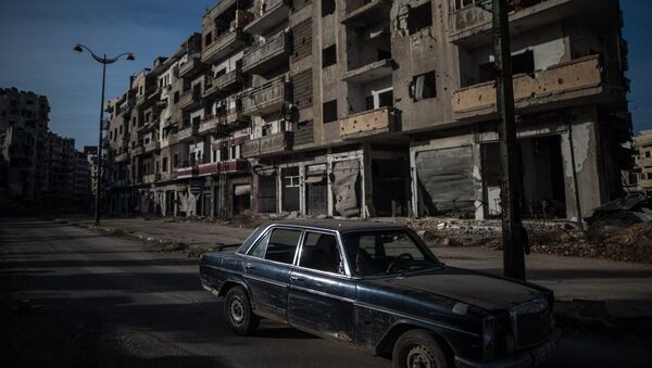 Разрушенные здания в районе Старого города в Хомсе