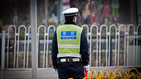 Сотрудник полиции в Китае. Архивное фото