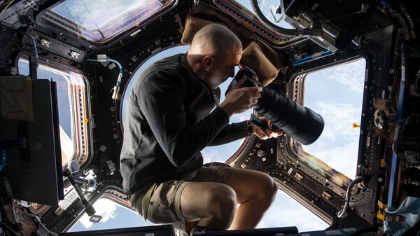 Астронавт NASA Скотт Келли фотографирует Землю с МКС. Архивное фото