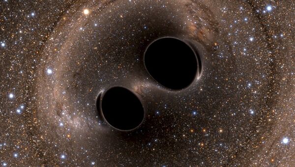 Кадр моделирования столкновения двух черных дыр в космосе. Архивное фото
