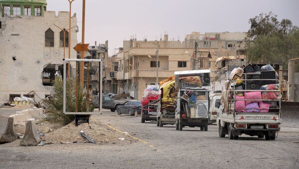 Колонна автомобилей мирных граждан в Сирии. Архивное фото