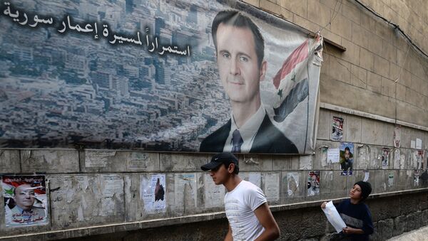 Предвыборный плакат с изображение Башара Асада. Архивное фото