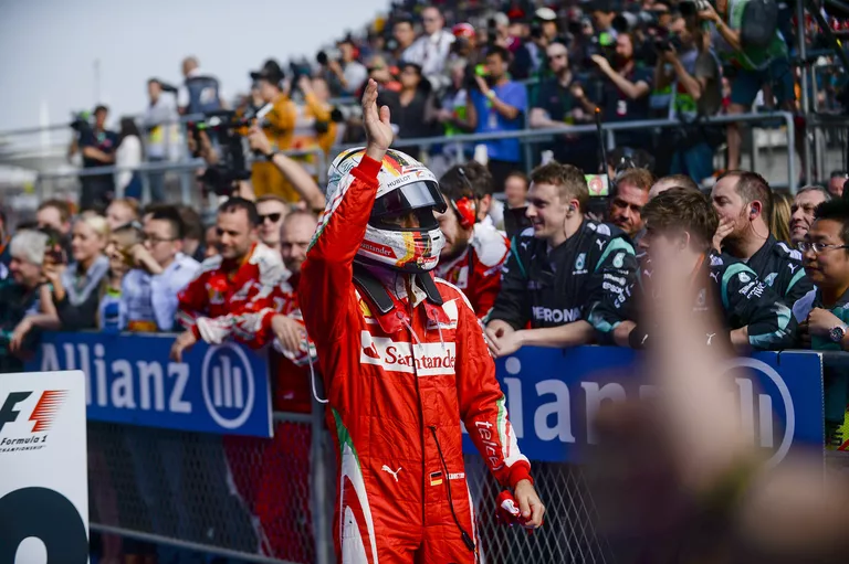Немецкий гонщик команды Scuderia Ferrari Себастьян Феттель Немецкий гонщик команды Scuderia Ferrari Себастьян Феттель
