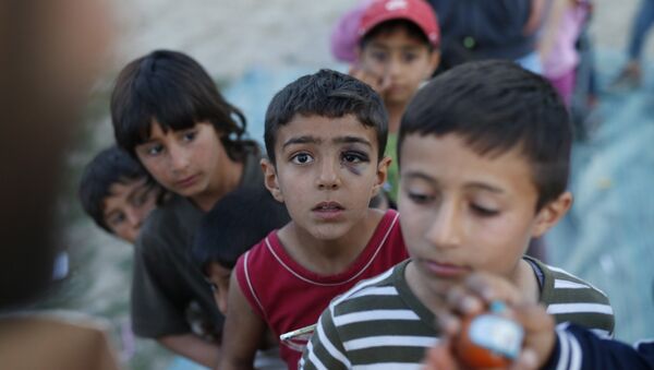 Дети в лагере для беженцев. Архивное фото