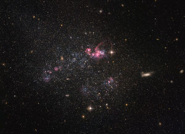Карликовая галактика, известная как UGC 4459 снятая телескопом Хаббл