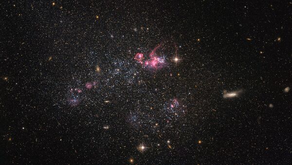 Карликовая галактика, известная как UGC 4459 снятая телескопом Хаббл