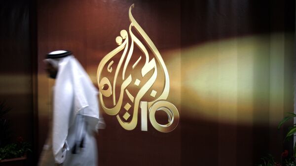 Сотрудник в офисе телекомпании Al Jazeera в Дохе, Катар