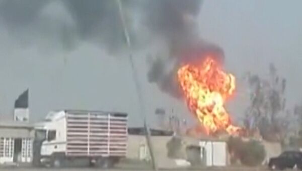 Кадры горящего в Ираке завода, на который напали боевики ИГ