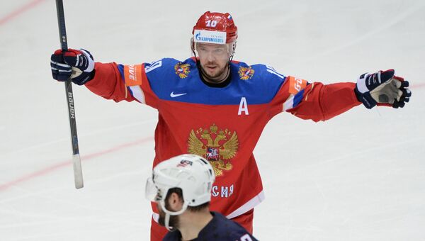Игрок сборной России Сергей Мозякин радуется своему забитому голу в матче за третье место чемпионата мира по хоккею между сборными командами России и США