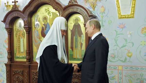 Президент РФ В. Путин и патриарх Кирилл. Архивное фото