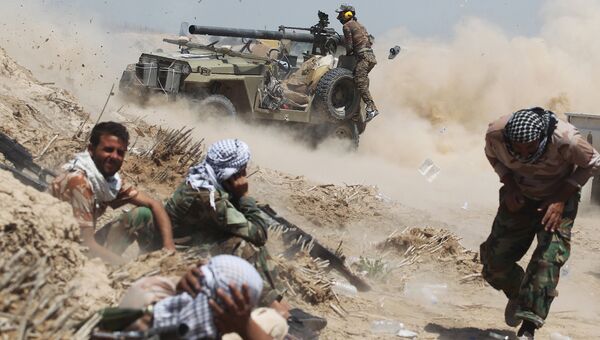Иракские проправительственные силы во время противостояния с боевиками ИГ. Архивное фото