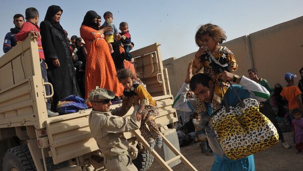 Беженцы с территории захваченной ИГ в Ираке. Архивное фото
