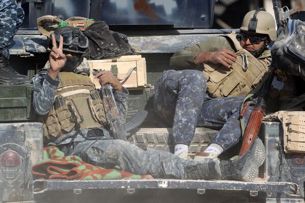 Иракские полицейские во время операции против ИГИЛ в городе Эль-Фаллуджа