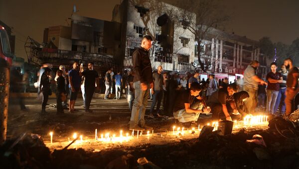 Свечи в память о погибших во время террористического акта в Багдаде. 4 июля 2016