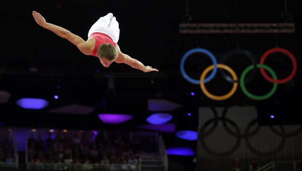 Россиянин Дмитрий Ушаков в мужском финале прыжков на батуте на летних Олимпийских играх 2012 в Лондоне. Архивное фото