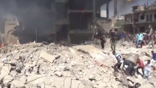 Горящие здания, машины и паника людей: последствия теракта в сирийском Камышли