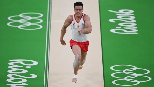 Никита Нагорный (Россия) выполняет опорный прыжок в квалификации среди мужчин на XXXI летних Олимпийских играх. Архивное фото