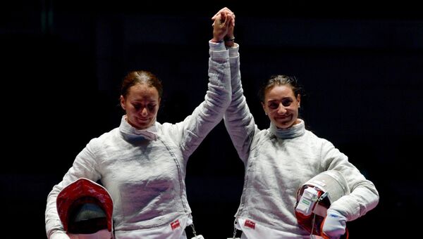 Софья Великая и Яна Егорян после завершения финального поединка на XXXI летних Олимпийских играх
